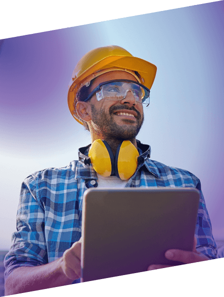man wearing hard hat and safety goggles on a tablet device