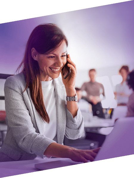 woman working in office with a team of people